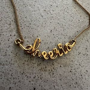 Biden gold necklace “Cheerio”